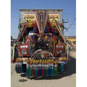  Man Fixing Decoration onto Truck for Diwali Celebrations 