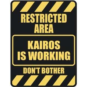   RESTRICTED AREA KAIROS IS WORKING  PARKING SIGN