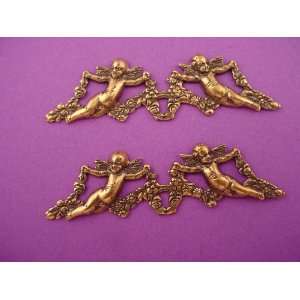   brass ox open pierced angels and floral stampings 