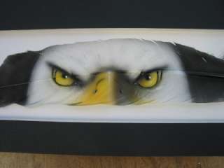 This auction is for a hand painted feather by artist Russ Abbott. The 