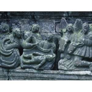  Religious Carving of People in Gray Stone on Church in 