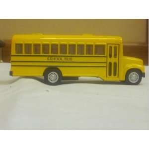  Yellow Toy School Bus with Stop Sign on Side and It Says School Bus 