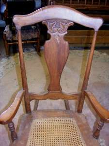 Vintage Brown Solid Wood Sturdy Rocking Chair w Cane Seat & Carved 