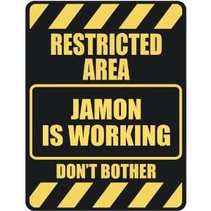   RESTRICTED AREA JAMON IS WORKING  PARKING SIGN