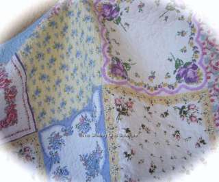   blue edging borders this quilt like a masterpiece painting in a frame
