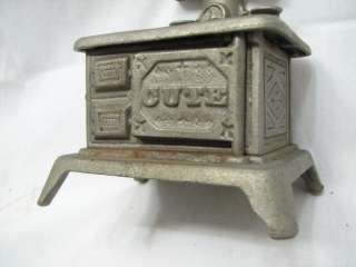 nice little toy or model stove. Door is marked cute and the door 