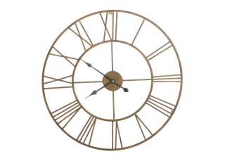   oversized wall clock has an open back and roman numerals on the face