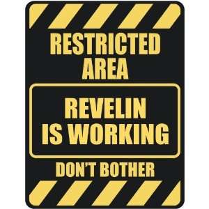   RESTRICTED AREA REVELIN IS WORKING  PARKING SIGN