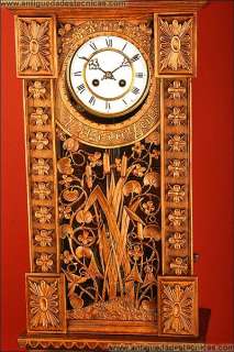 Hand carved wall clock in cypress wood. 19th century  