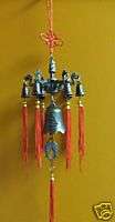 Brass finished windchime in dragon, bell, fish design  