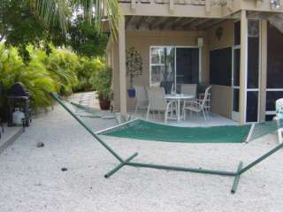   enjoy a cocktail in front of our 300 gallon outdoor living reef