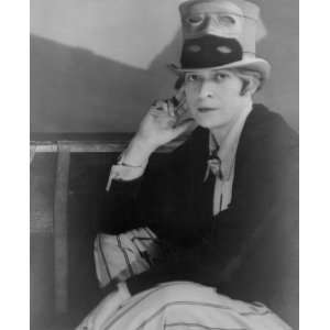 1927 photo Janet Flanner, full length portrait, seated, wearing top 