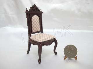 Mahogany carved wood frame with soft pint gird pattern seat.